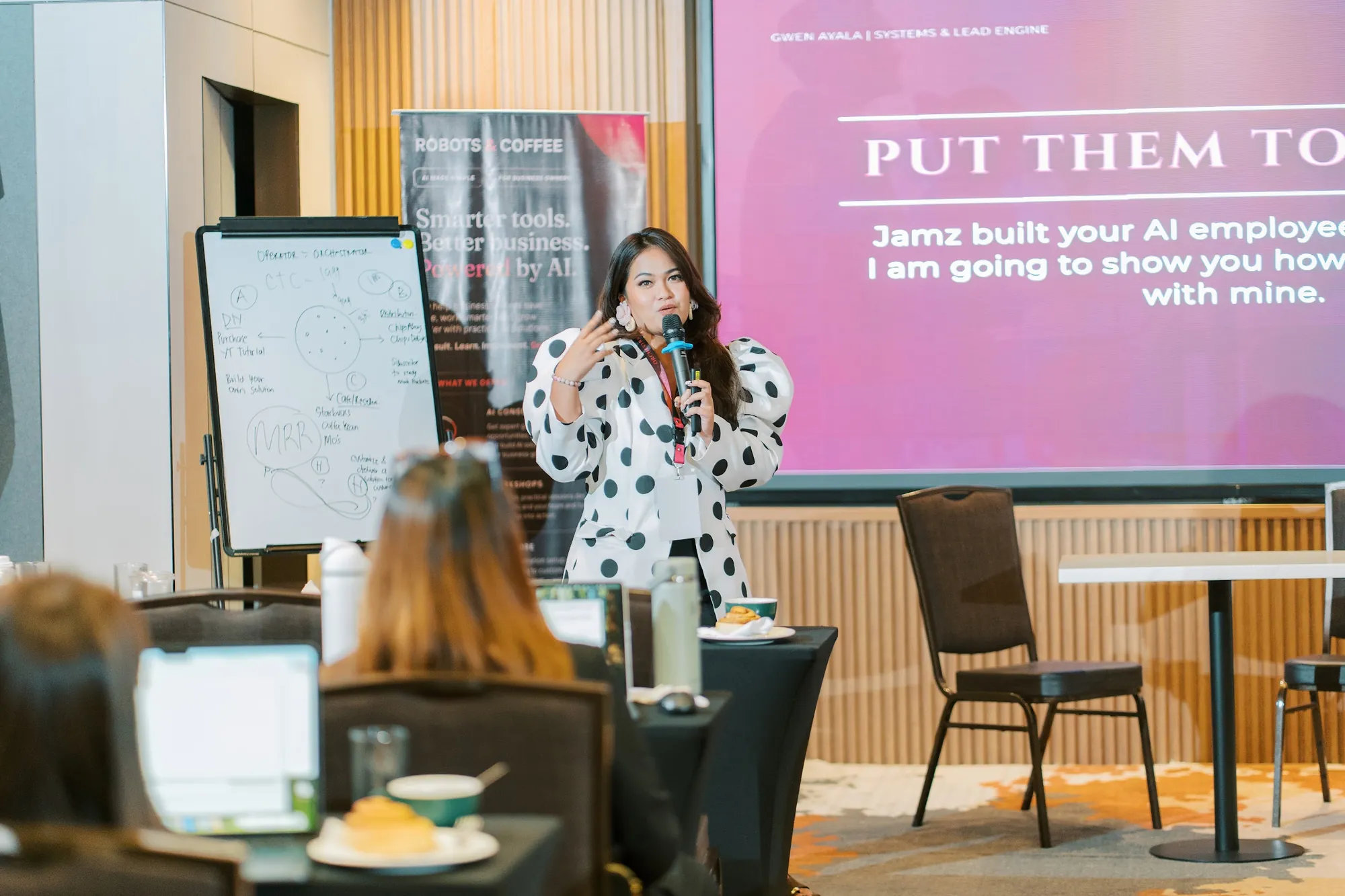 Gwen Ayala on stage in front of a slide that reads Jamz built your AI employee